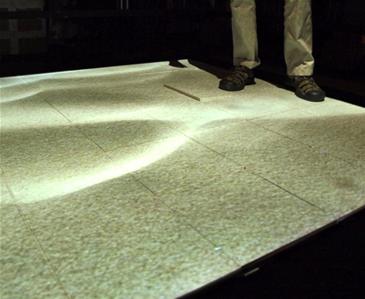 The tiles in this floor give physical feedback, and can simulate different surfaces such as sand or grass.
