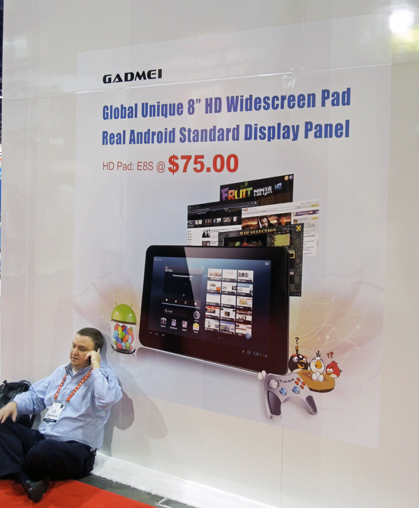 This ad (and the gentleman sitting below it) pretty much sum up where CES is headed: A plethora of super-cheap products from companies you never heard of.
