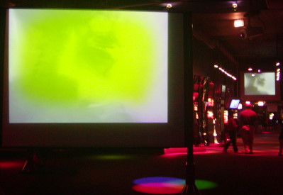 Two screens show the aging effect on an LCD front projector image.
