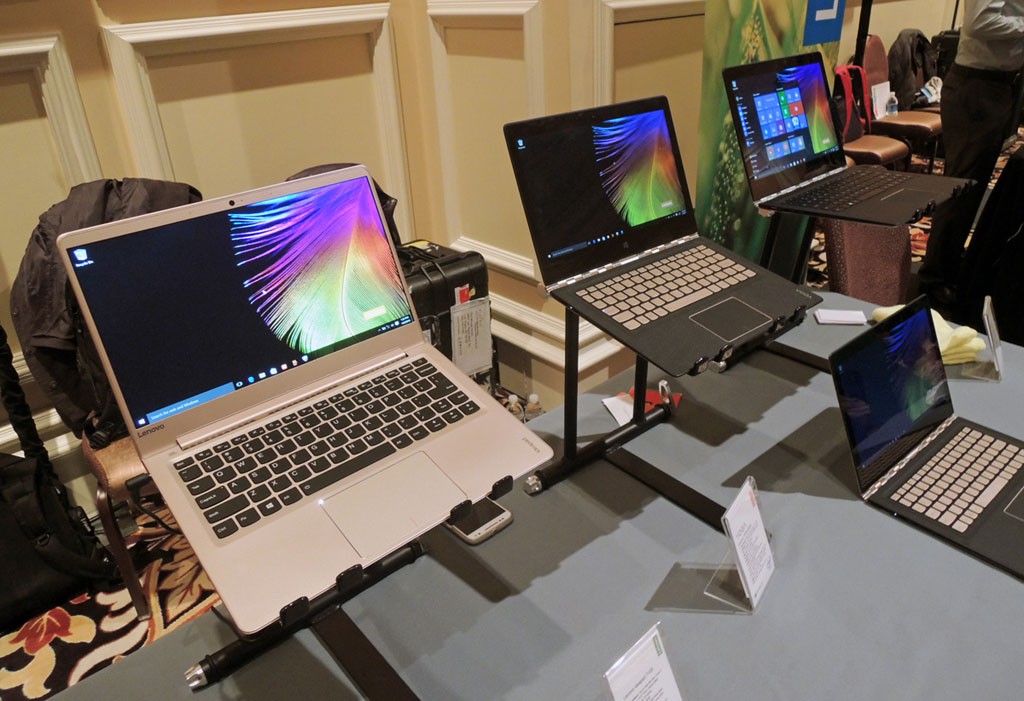 Lenovo is one of four laptop manufacturers now offering OLED screens, here on a ThinkPad X1 Yoga (right).