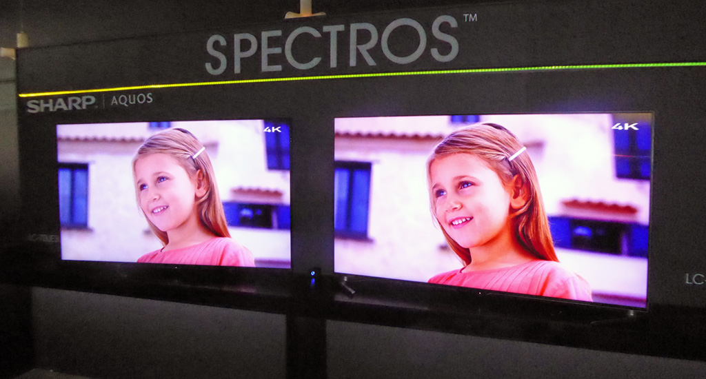 A conventional Sharp LCD TV is on the left, and a new UH model with SPECTROS color rendering is on the right. This photo doesn't do it justice, but the increase in color saturation is quite noticeable.