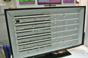 Two-year-old Samsung TV, as seen at the GrafTech International booth at SID 2014. The display is removed to show the full-array LED backlight. GrafTech makes the graphite heat spreaders seen under the LEDs on the left side of the backlight. (Photo: Ken Werner) Two-year-old Samsung TV. The display is removed to show the full-array LED backlight.