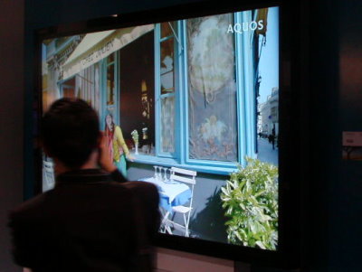 Sharp's 108 in. LCD TV monitor is huge; note the person in front of the screen.