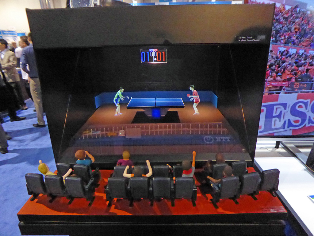 NTT had this compact virtual reality theater, showing a ping-pong game to tiny dolls. 